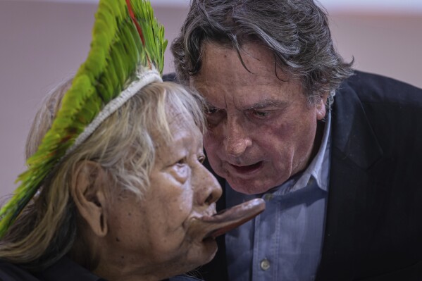 FILE - Indigenous Chief Raoni Metuktire, left, and Belgian filmmaker Jean-Pierre Dutilleux attend a meeting at the ChangeNOW summit in Paris, France, May 27, 2023. For five decades, the Amazonian tribal chief and Belgian film director enlisted presidents and royals, even Pope Francis, to improve the lives of Brazil’s Indigenous peoples and protect their lands. Behind the scenes, however, the relationship was nearing its end. Not long after returning to Brazil in May 2023, the chief of the Kayapo severed ties with his Belgian acolyte. (AP Photo/Aurelien Morissard, File)