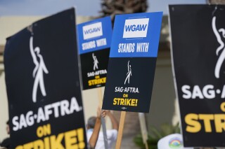 FILE - Picketers demonstrate outside Paramount Pictures studio on Wednesday, Sept. 27, 2023, in Los Angeles. Unions commanded big headlines last year, but that didn’t translate into higher membership numbers, according to government data released Tuesday, Jan. 23, 2024. (AP Photo/Chris Pizzello, File)