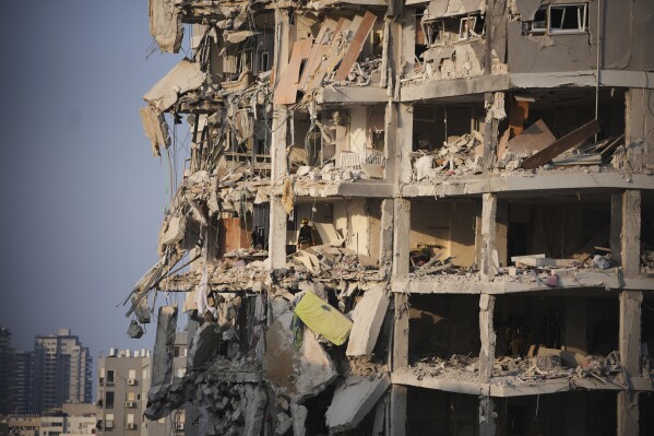 The Newest: Loss of life toll grows as Israel and Iran business assaults for 3rd day