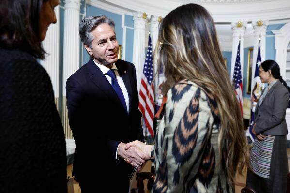 Secretary of State Antony Blinken greets people after speaking about the roll-out of the International Religious Freedom Report at the State Department in Washington, Monday, May 15, 2023. (Jonathan Ernst/Pool Photo via AP)