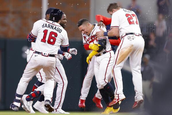 Atlanta Braves William Contreras reacts with teammates after his game winning single in the ninth inning of a baseball game against the Philadelphia Phillies, Tuesday, May 24, 2022, in Atlanta. (AP Photo/Todd Kirkland)