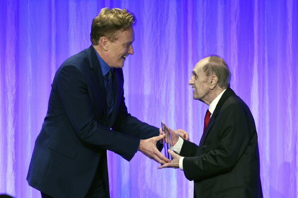 Honoree Bob Newhart, right, accepts his award from presenter Conan O'Brien during "The Paley Honors: A Special Tribute to Television's Comedy Legends" at the Beverly Wilshire Hotel, Thursday, Nov. 21, 2019, in Beverly Hills, Calif. (Photo by Chris Pizzello/Invision/AP)