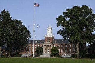 FILE - The United States Coast Guard Academy is seen, Sept. 14, 2020, in New London, Conn. Fifty-five U.S. Coast Guard Academy cadets have been disciplined for sharing homework answers in violation of academy policy, Coast Guard officials announced. (AP Photo/Jessica Hill, File)