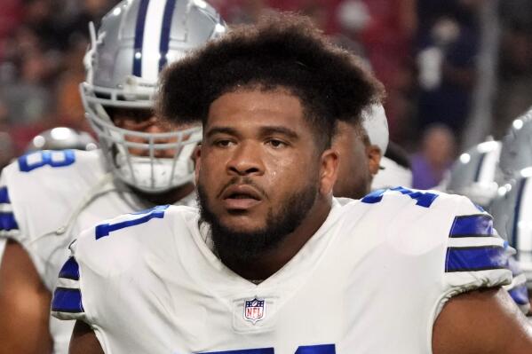 FILE - In this Aug. 13, 2021, file photo, Dallas Cowboys' La'el Collins walks off the field during a preseason NFL football game against the Arizona Cardinals in Glendale, Ariz. The NFL accused Cowboys offensive lineman Collins of trying to bribe a drug-testing official before he was suspended five games for a violation of the substance-abuse policy, according to court documents released Friday, Oct. 8, 2021. (AP Photo/Rick Scuteri, File)