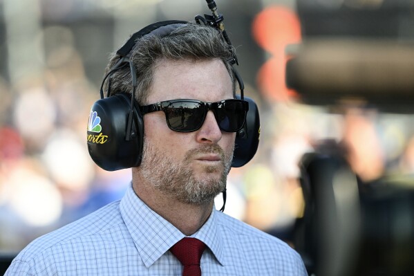 Hall of Fame driver Dale Earnhardt Jr. looks on prior to a NASCAR Cup Series auto race at Darlington Raceway, Sept. 3, 2023, in Darlington, S.C. (AP Photo/Matt Kelley, File)