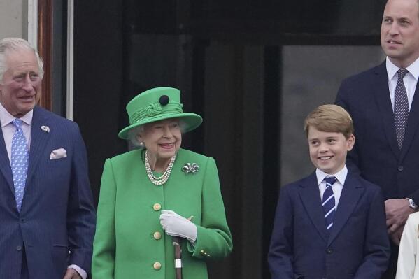 From left, Prince Charles, Queen Elizabeth II, Prince George and Prince William appear on the balcony of Buckingham Palace during the Platinum Jubilee Pageant outside Buckingham Palace in London, Sunday June 5, 2022.  After four days of parades, street parties and a gala concert celebrating Queen Elizabeth II's 70 years on the throne, the Platinum Jubilee ended Sunday with the crowd outside Buckingham Palace singing "God Save the Queen." But as the tributes to the queen's lifetime of service begin to fade, Britain is left with the reality that the second Elizabethan age is coming to an end. (Jonathan Brady/Pool Photo via AP)
