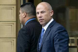 FILE - In this July 23, 2019, file photo, California attorney Michael Avenatti walks from a courthouse in New York, after facing charges. On Wednesday, June 9, 2021, Avenatti's lawyers said he should spend no more than six months behind bars after a jury concluded he tried to extort $25 million from Nike. (AP Photo/Craig Ruttle, File)