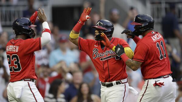 Brian Jordan of the Atlanta Braves celebrates his two-run home run