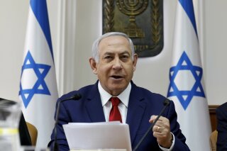 
              Israeli Prime Minister Benjamin Netanyahu opens the weekly cabinet meeting at the prime minister's office in Jerusalem, Sunday, Jan. 6, 2019. (Gali Tibbon/Pool via AP)
            