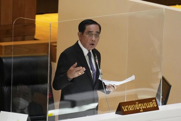 Thailand Prime Minister Prayuth Chan-ocha answers questions during a no-confidence debate at the Parliament in Bangkok, Thailand, Tuesday, July 19, 2022. Thailand's opposition parties on Tuesday began a no-confidence debate targeting Prayuth and ten of his Cabinet members, who face accusations of corruption and economic mismanagement.   (AP Photo/Sakchai Lalit)