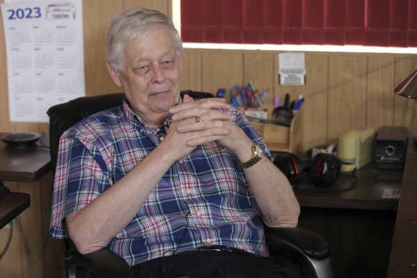 Eric Meyer, publisher of the Marion, Kansas, County Record, speaks to reporters about the aftermath of the raid on his home and his newspaper's offices by police, Monday, Aug. 14, 2023, in Marion, Kan. (AP Photo/John Hanna)