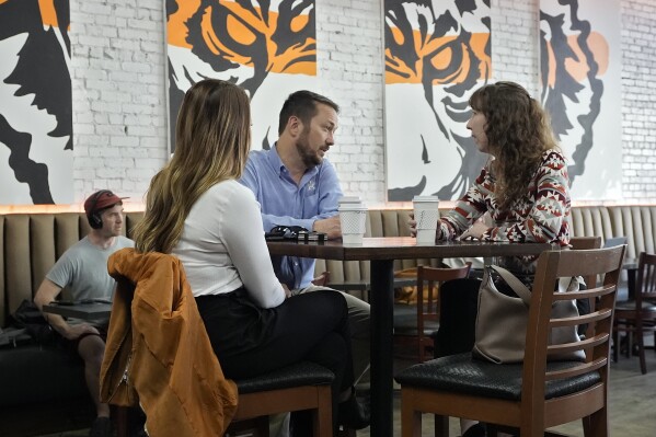 FILE - Customers drink coffee at the Blind Tiger Cafe Jan. 10, 2024, in Tampa, Fla. On Wednesday, April 10, 2024, the Labor Department issues its report on inflation at the consumer level in March. (AP Photo/Chris O'Meara, File)
