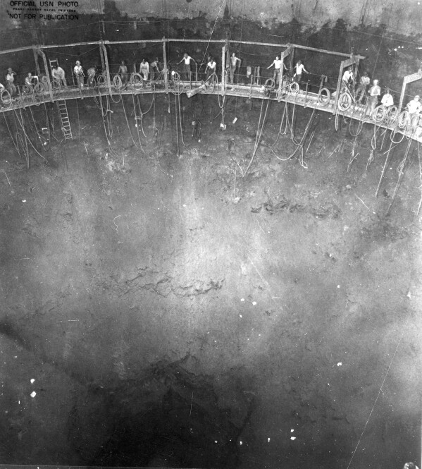 FILE - This image provided by the U.S. Army Corps of Engineers shows a 1942 Navy photo of miners building one of the 20 fuel tanks of Defense Logistics Agency's Red Hill Underground Fuel Storage Facility at Joint Base Pearl Harbor, Hawaii, connected by a miles-long tunnel. A trial is set to start on Monday, April 29, 2024, in a case surrounding the 2021 leaked jet fuel into the Navy water system that serves 93,000 people on and around the Pearl Harbor base. There are 17 people suing the United States over the leak and continuing health problems they argue are tied to the tainted water. (U.S. Army Corps of Engineers via AP, File)