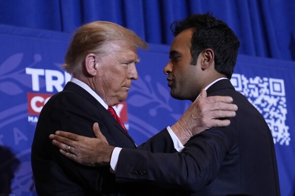 Republican presidential candidate former President Donald Trump embraces former candidate Vivek Ramaswamy at a campaign event in Atkinson, N.H., Jan. 16, 2024. (AP Photo/Matt Rourke, File)
