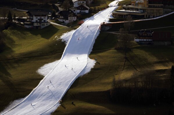 People ski on a slope near Schladming, Austria, Jan. 6, 2023.(AP Photo/Matthias Schrader)