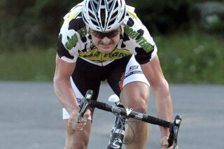In this July 30, 2010, file photo, Floyd Landis sprints to the finish line after racing a 2.3-mile time trial section during the Tour of the Catskills cycling race in Tannersville, N.Y. Landis has announced plans to open a bicycle showroom and coffee shop that will sell hemp products in Lancaster, Pennsylvania. (AP Photo/Hans Pennink, File)