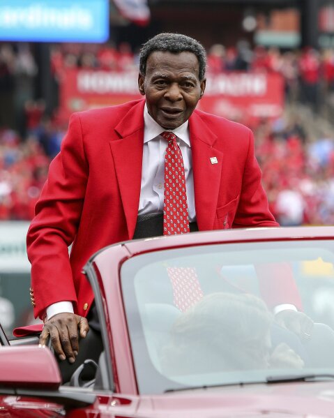 FILE - In this April 5, 2019, file photo, former St. Louis Cardinals great Lou Brock rides around the warning track prior to the Cardinals home opener baseball game against the San Diego Padres in St. Louis. Hall of Famer Brock, one of baseball’s signature leadoff hitters and base stealers who helped the Cardinals win three pennants and two World Series titles in the 1960s, has died. He was 81. (AP Photo/Scott Kane, File)