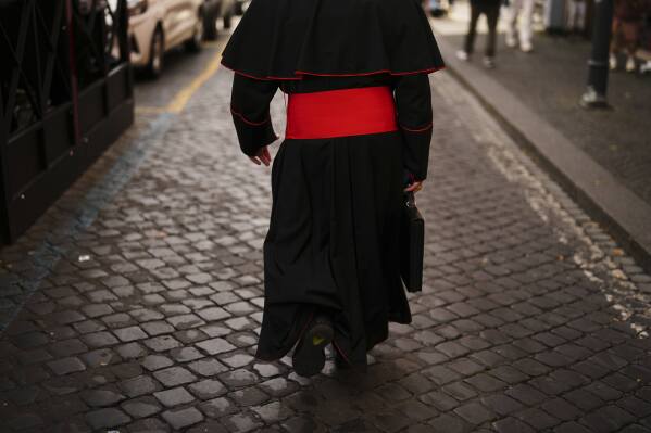 Cardinal John Dew leaves the Vatican on Monday, May 5, 2025, after attending the General Congregation of cardinals in the New Synod Hall where they are preparing for the upcoming conclave starting on May 7, to elect the 267th Roman pontiff. (AP Photo/Francisco Seco)