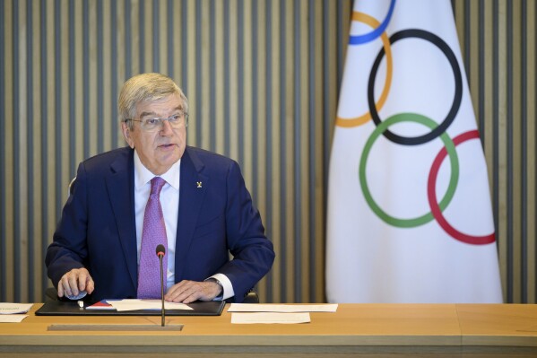 International Olympic Committee (IOC) President Thomas Bach speaks at the opening of the executive board meeting of the International Olympic Committee (IOC), at the Olympic House, in Lausanne, Switzerland, Tuesday, March 19, 2024. (Laurent Gillieron/Keystone via AP)