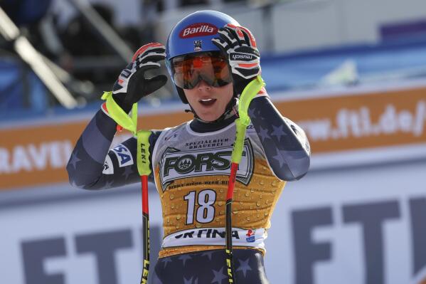 United States' Mikaela Shiffrin arrives at the finish area of an alpine ski, women's World Cup downhill race, in Cortina d'Ampezzo, Italy, Saturday, Jan. 21, 2023. (AP Photo/Alessandro Trovati)