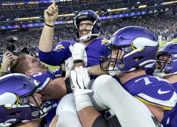 Minnesota Vikings kicker Greg Joseph celebrates with teammates after kicking the game-winning field goal in overtime against the Indianapolis Colts in an NFL football game, Saturday, Dec. 17, 2022, in Minneapolis, Minn. (Carlos Gonzalez/Star Tribune via AP)