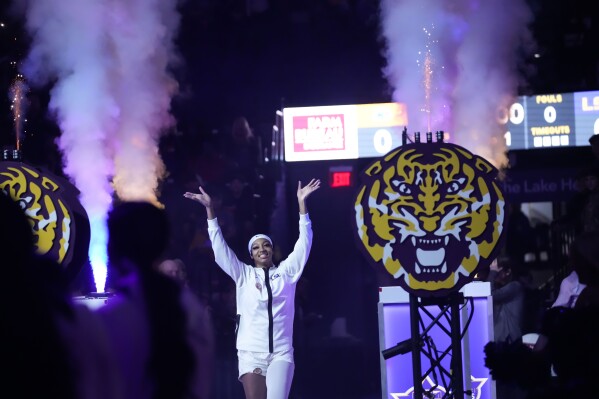 LSU forward Angel Reese waves to the crowd as she is introduced before an NCAA college basketball game against Kent State in Baton Rouge, La., Tuesday, Nov. 14, 2023. (AP Photo/Gerald Herbert)
