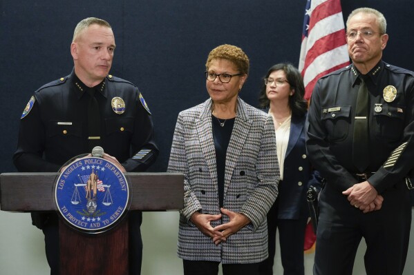 Beverly Hills Police Chief Mark Stainbrook, left, Mayor Karen Bass and Los Angeles Police Chief Michel Moore announce the arrest of a suspect in three recent killings of homeless men, Saturday, Dec. 2, 2023, in Los Angeles. (AP Photo/Damian Dovarganes)