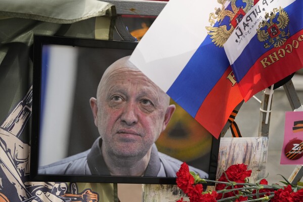 FILE - A portrait of the owner of mercenary chief Yevgeny Prigozhin decorates an informal street memorial near the Kremlin in Moscow, Russia, on Saturday, Aug. 26, 2023. (AP Photo/Alexander Zemlianichenko, File)