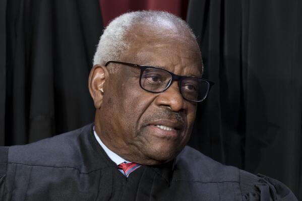 Justice Clarence Thomas joins other members of the Supreme Court as they pose for a group portrait, at the Supreme Court building in Washington, Friday, Oct. 7, 2022. (AP Photo/J. Scott Applewhite)