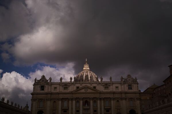 Clouds drift over St. Peter's Basilica during the cardinals' conclave to elect a new pope, at the Vatican, Thursday, May 8, 2025. (AP Photo/Emilio Morenatti)