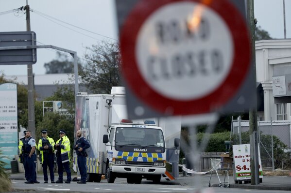 
              Police gather outside the Linwood mosque, site of one of the mass shootings at two mosques in Christchurch, New Zealand, Saturday, March 16, 2019. (AP Photo/Mark Baker)
            