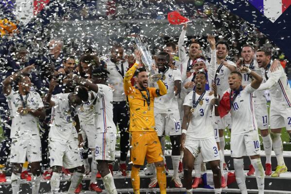 France's players celebrate their victory at the end of the UEFA Nations League final soccer match between France and Spain at the San Siro stadium, in Milan, Italy, Sunday, Oct. 10, 2021. (AP Photo/Luca Bruno)