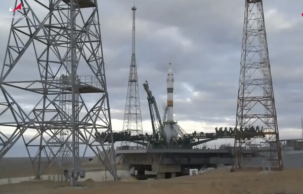 In this photo taken from video released by Roscosmos space corporation, the Soyuz-2.1a rocket booster with Soyuz MS-25 space ship carrying a new crew to the International Space Station, ISS, stands at the launch pad after cancellation of the launch at the Russian leased Baikonur cosmodrome, Kazakhstan, Thursday, March 21, 2024. Russia's Roscosmos space agency has aborted the launch of three astronauts to the International Space Station about 20 seconds before they were scheduled to lift off. Officials say the crew is safe. The Russian Soyuz rocket was to carry NASA astronaut Tracy Dyson, Oleg Novitsky of Roscosmos and Marina Vasilevskaya of Belarus from the Russia-leased Baikonur launch facility in Kazakhstan. (Roscosmos space corporation via AP)
