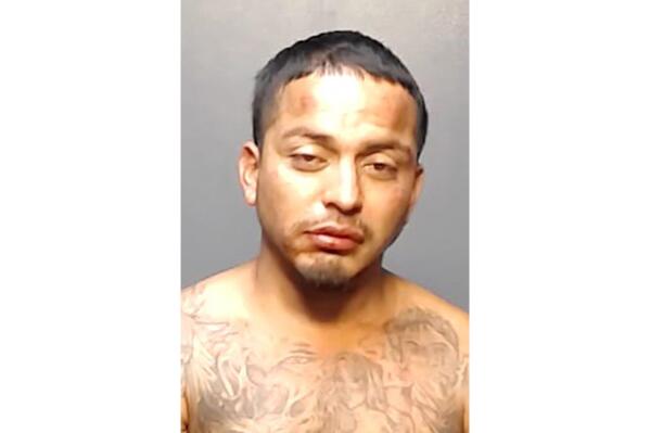 This booking photo provided by the Brownsville, Texas, Police Department shows George Alvarez. Alvarez, the driver of an SUV that killed eight people when it slammed into a bus stop in Brownsville, early Sunday, May 7, 2023, has been charged with manslaughter, police said Monday, May 8, as investigators tried to determine if the crash was intentional. (Brownsville Police Department via AP)