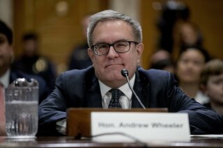 FILE - In this Jan. 16, 2019 file photo, Andrew Wheeler is shown at a Senate Environment and Public Works Committee hearing to be the administrator of the Environmental Protection Agency, on Capitol Hill in Washington. Wheeler is telling CBS News in an interview airing Wednesday morning that climate change is “an important issue,” but that most of the threats it poses are “50 to 75 years out.” (AP Photo/Andrew Harnik)
