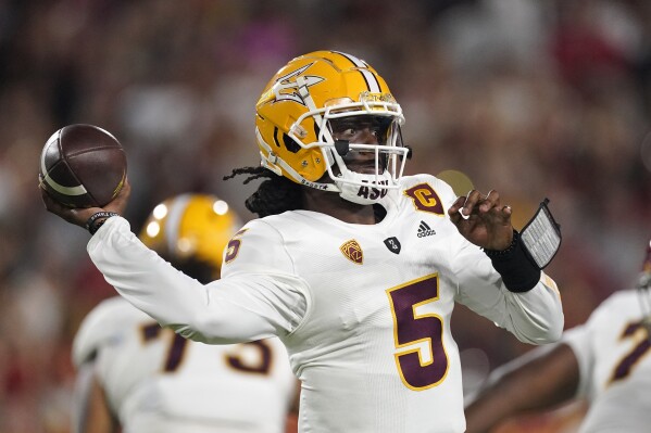 FILE - Then-Arizona State quarterback Emory Jones passes during the first half of an NCAA college football game against Southern California Saturday, Oct. 1, 2022, in Los Angeles. Jones now plays at Cincinnati. Cincinnati opens their season at home against Eastern Kentucky on Sept. 2. (AP Photo/Mark J. Terrill, File)