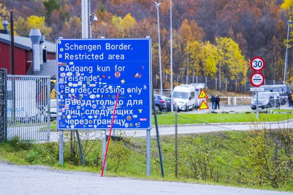 FILE - A sign indicating the Storskog border crossing between Russia and Norway is pictured near Kirkenes, Norway, on Sept. 28, 2022. Norway on Thursday May 23, 2024 said it would further tighten entry rules from Russia, saying those with tourist visas issued by Norway before regulations were strengthened in spring 2022 or issued by another European country, will be barred from entering the Scandinavian country as of next week. (Lise Aserud/NTB Scanpix via AP, File)