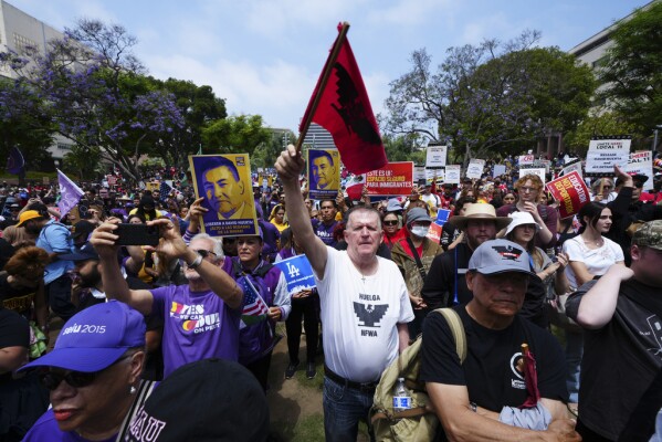 Supporters gather as civil rights legend Dolores Huerta, 95, speaks at a rally in Los Angeles, Monday, June 9, 2025, calling for the release of labor union leader David Huerta, who was arrested during a protest on June 6. (AP Photo/Damian Dovarganes)