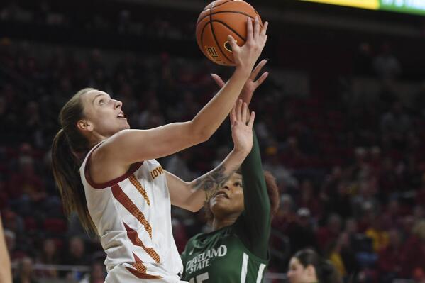 Iowa State guard Emily Ryan, left, goes to the basket against Cleveland State forward Brittni Moore (15) during the first half of an NCAA women's college basketball game at Jack Trice Stadium in Ames, Iowa, Monday, Nov. 7, 2022. (Nirmalendu Majumdar/Ames Tribune via AP)