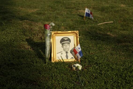 FILE - A photograph of the late Lieutenant Armando Chiru, who was killed during the 1989 US-led invasion of Panama, adorns his grave in the Jardin de Paz cemetery in Panama City, Dec. 20, 2012. The president of Panama on Thursday, March 31, 2022, declared Dec. 20 an annual national holiday to commemorate Panamanians who died during the 1989 U.S. invasion of the country. (AP Photo/Arnulfo Franco, File)