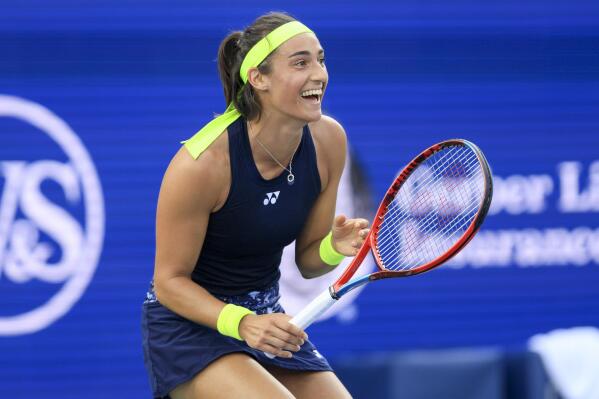 Caroline Garcia, of France, reacts as she defeats Petra Kvitova, of the Czech Republic, during the women's singles final of the Western & Southern Open tennis tournament, Sunday, Aug. 21, 2022, in Mason, Ohio. (AP Photo/Aaron Doster)