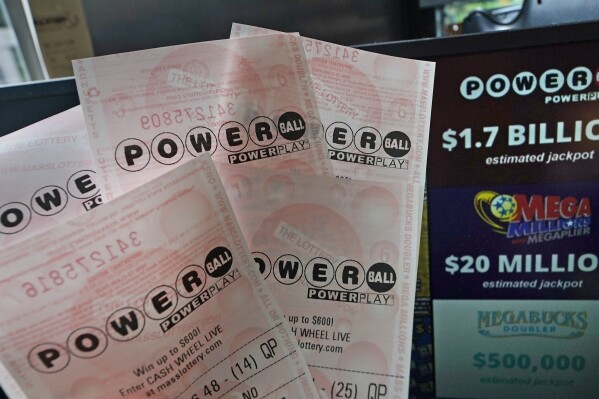 Powerball tickets are shown at a lottery agent, Tuesday, Oct. 10, 2023, in Haverhill, Mass. After 35 straight drawings without a big winner, Powerball players will have a shot Wednesday at a near-record jackpot worth an estimated $1.73 billion. (AP Photo/Charles Krupa)