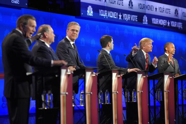 FILE - From left, Ohio Gov. John Kasich, former Arkansas Gov. Mike Huckabee, former Florida Gov. Jeb Bush, Sen. Marco Rubio, R-Fla., Donald Trump and Ben Carson, participate in a debate for Republican presidential hopefuls in Boulder, Colo., Oct. 28, 2015. It's been more than seven years since the 2016 presidential campaign, and Republicans are still trying to figure out how to run against Donald Trump. (AP Photo/Mark J. Terrill, File)
