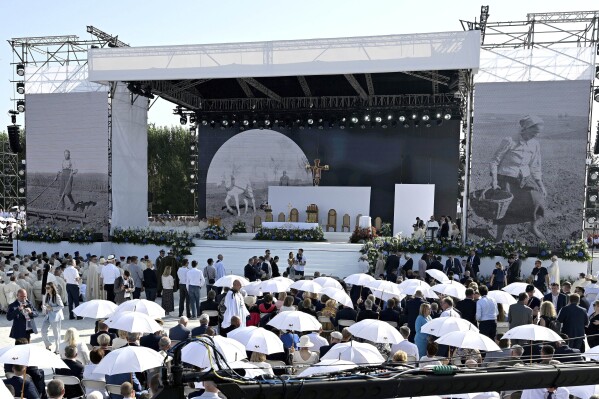 Crowd attending a Mass in which the Vatican beatified the Polish Ulma family, including small children, who were killed by the Nazis in 1944 for having sheltered Jews, in the Ulmas' home village of Markowa Poland, on Sunday, Sept. 10, 2023. The Vatican beatified also the Ulmas' unborn child, saying it was born during the killings and was baptized in the martyred mother's blood. (AP Photo)