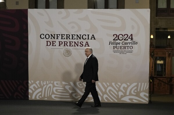 FILE - Mexican President Andres Manuel Lopez Obrador arrives to start his daily, morning press conference at the National Palace in Mexico City, March 1, 2024. Lopez Obrador commented on the country's first presidential debate ahead of the June election, expressing anger on Tuesday, April 9, 2024, that debate moderators posed questions about corruption and problems with the education and healthcare systems, issues he says he has resolved. (AP Photo/Marco Ugarte, File)