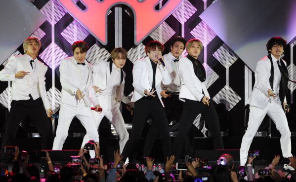 FILE - BTS performs during the KIIS-FM Jingle Ball concert on Dec. 6, 2019, in Inglewood, Calif. The group is nominated for best pop duo/group performance at the Grammy awards, pitting their hit against hits from Lady Gaga, Ariana Grande, Taylor Swift, Justin Bieber, Bad Bunny and Dua Lipa. BTS will also perform during the show, airing on Sunday, March 14, 2021.  (AP Photo/Chris Pizzello, File)