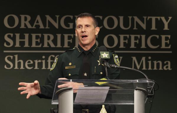 Orange County Sheriff John Mina addresses the media during a press conference about multiple shootings, Wednesday, Feb. 22, 2023, in Orlando, Fla. A central Florida television journalist and a little girl were fatally shot Wednesday afternoon near the scene of a fatal shooting from earlier in the day, authorities said. Mina said that they’ve detained Keith Melvin Moses, 19, who they believe is responsible for both shootings in the Orlando-area neighborhood. (Ricardo Ramirez Buxeda/Orlando Sentinel via AP)