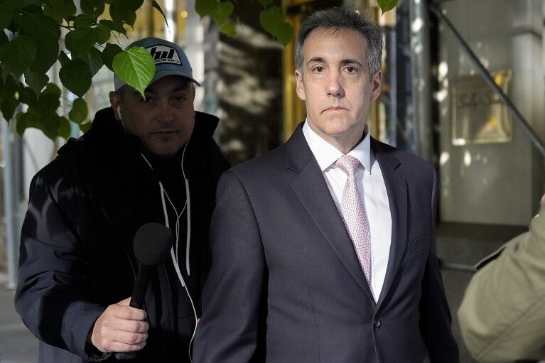 Michael Cohen leaves his building to go to Manhattan Criminal Court on Monday, May 13, 2024, in New York.  (AP Photo/Julia Nikhinson)