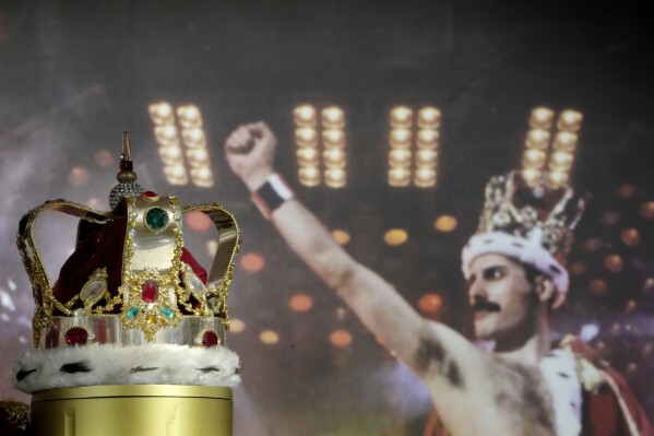 FILE - Freddie Mercury's signature crown worn throughout the 'Magic' Tour, on display at Sotheby's auction rooms in London, Thursday, Aug. 3, 2023. A Victorian-style silver snake bangle Freddie Mercury wore with an ivory satin catsuit in the “Bohemian Rhapsody” video has sold for the highest price ever paid for a piece of jewelry owned by a rock star. Sotheby's says the sale price of nearly 700,000 pounds more than doubled the amount paid for John Lennon’s leather and bead talisman in 2008. The auction includes Mercury's flamboyant stage costumes, drafts to hits such as “We are the Champions.” (AP Photo/Kirsty Wigglesworth, File)