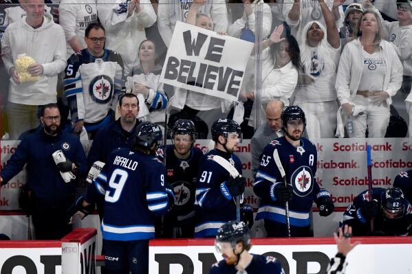 Winnipeg Jets' Vladislav Namestnikov (7) returns to the bench with teammates after scoring on the Dallas Stars during the third period of an NHL playoff hockey game in Winnipeg, Thursday, May 15, 2025. (Fred Greenslade/The Canadian Press via AP)